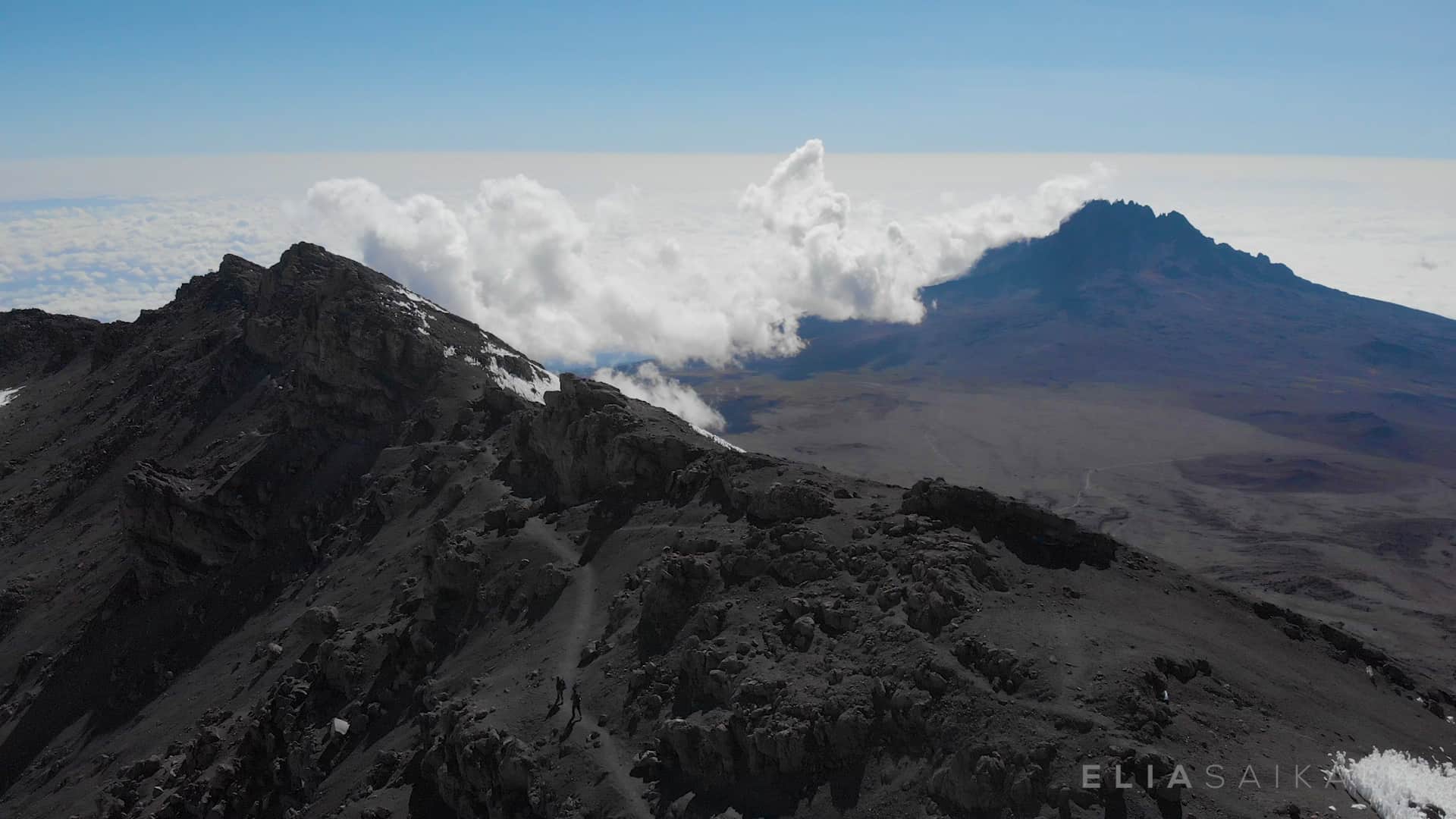 Kilimanjaro fly by over the ridge arial Elia Saikaly Licensing